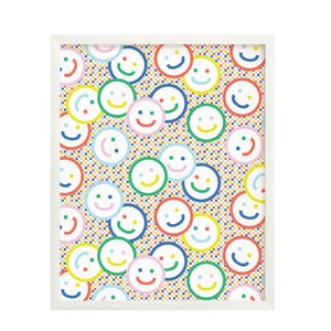 May include: White framed print with a colorful pattern of smiley faces on a white background with a checkered pattern.
