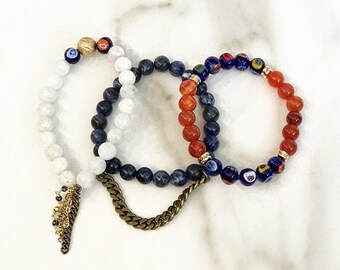 Beaded Stackable Stretch Bracelets with Chains in Shades of Blue, white, and orange.