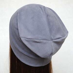 May include: A gray slouchy beanie hat made of soft fabric.