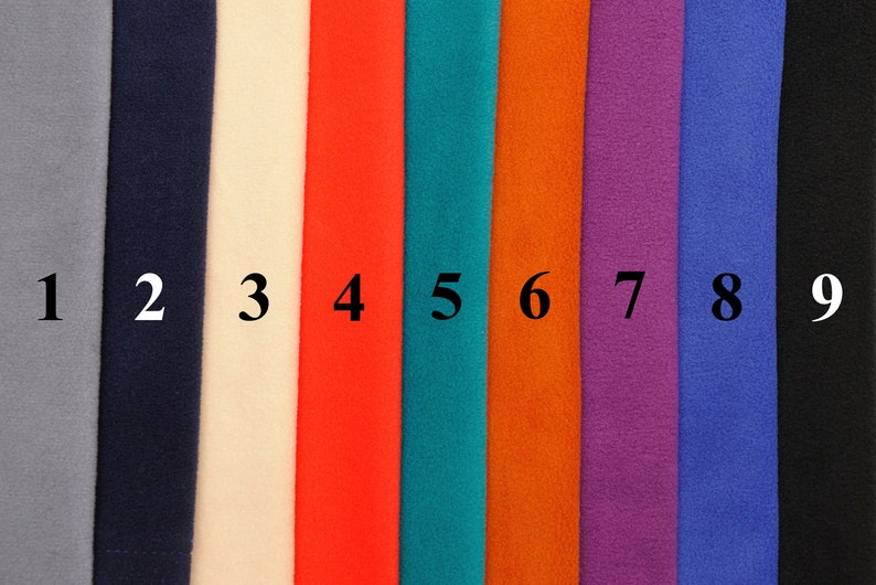 May include: Nine fabric swatches in different colors, numbered 1 through 9. The colors are gray, navy blue, off-white, red, teal, orange, purple, blue, and black.