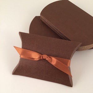 Chocolate brown pillow box for favors.