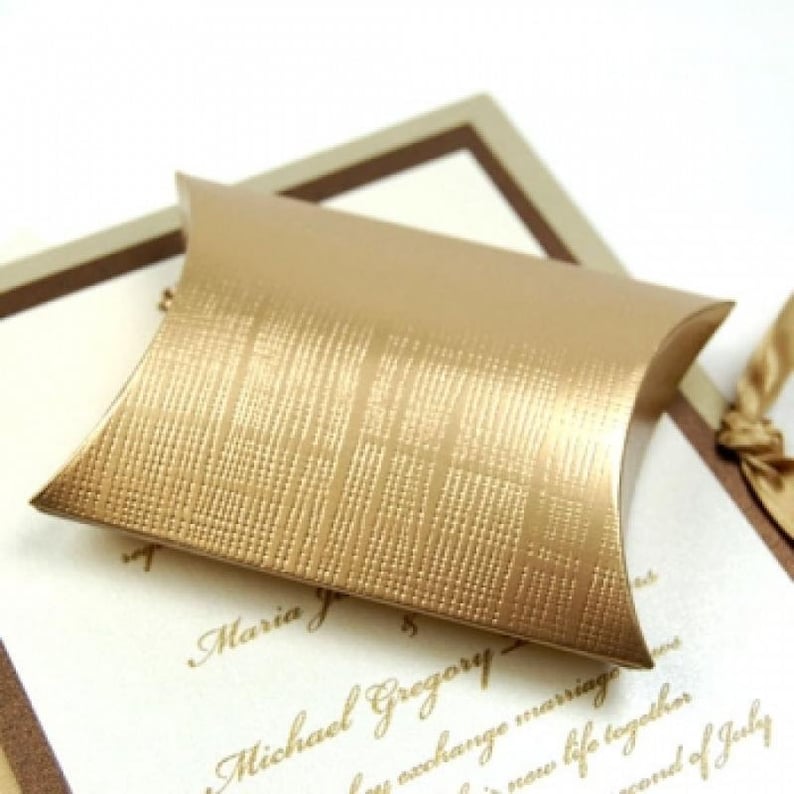 Gold pillow box for favors.