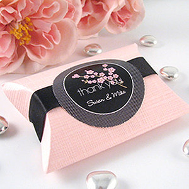 Pink pillow box for favors.