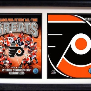 May include: A framed collage featuring the Philadelphia Flyers hockey team. The left side shows a group of Flyers players in their orange and black uniforms with the team logo and the text "Philadelphia Flyers All-Time Greats". The right side shows the Flyers logo with the text "Flyers".