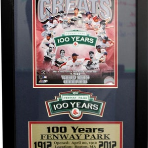 May include: A framed print commemorating the 100th anniversary of Fenway Park, home of the Boston Red Sox. The print features a collage of Red Sox greats, including Ted Williams, Carl Yastrzemski, and David Ortiz. The print also includes the text "Fenway Park 100 Years" and "1912-2012".
