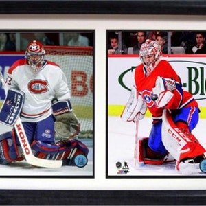 May include: Two hockey goalies wearing Montreal Canadiens jerseys in action. The goalie on the left is wearing a white jersey with red and blue accents, and the goalie on the right is wearing a red jersey with blue and white accents. Both goalies are wearing protective gear and holding hockey sticks.