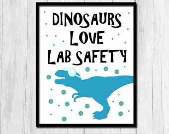 May include: A white printable poster with a blue dinosaur wearing safety goggles. The text on the poster reads "Dinosaurs Love Lab Safety".