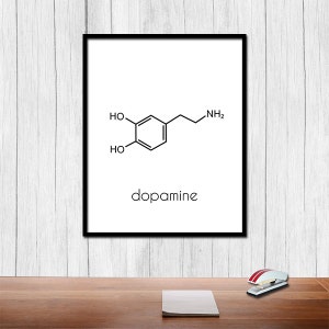 May include: A black and white illustration of the chemical structure of dopamine, a neurotransmitter, with the word "dopamine" printed below the structure.