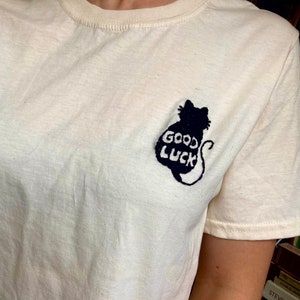 Good Luck Black Cat Tee | Lucky Black Cat Graphic | Cute Black Cat Embroidery | Spooky Cat Apparel | Whimsical Cat Lover Halloween Tee