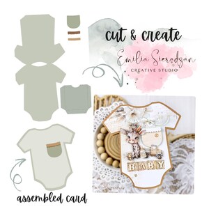 May include: A baby-themed card and die-cut templates. The assembled card is shaped like a onesie, featuring a giraffe, the word "BABY", and a pocket. The templates are in light green and brown. Text reads "cut & create" and "Emilia Sieradzan".