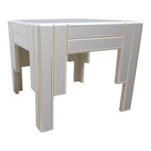 May include: A white mirrored side table with a geometric design. The table has a square top and four legs.