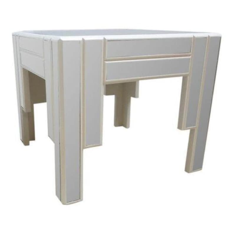May include: A white mirrored side table with a geometric design. The table has a square top and four legs.