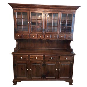 May include: A handmade wooden sign with the text "Welcome" in a playful font. The sign features a distressed white background and a dark brown border. A small, decorative heart is attached to the bottom.