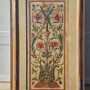 May include: A framed print of a vintage botanical illustration featuring a stylized floral design with red, yellow, and green flowers and leaves. The print is framed in a distressed gold frame with a beaded edge.