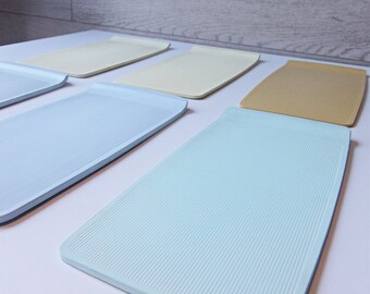 Six midcentury hard plastic trays made in GDR