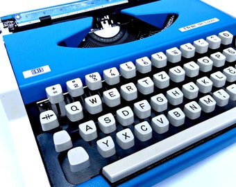 Vintage blue UNIS typewriter made in Yugoslavia