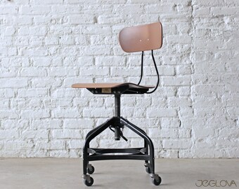mid-century modern classic vintage height-adjustable swiveling and rolling chair by the Toledo Metal Furniture Company