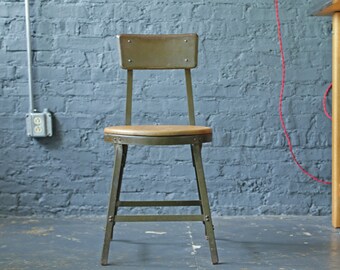 vintage industrial heavy-duty steel chair with wood seat, footrest and tapered legs