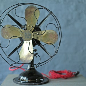 vintage oscillating cast iron base and brass blade fan by Robbins and Myers Co, circa 1920 image 1