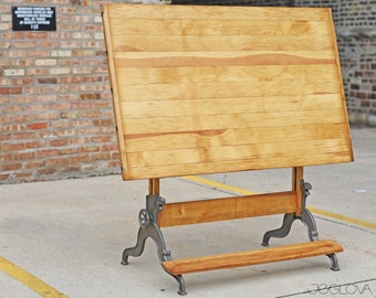 vintage industrial drafting table with footrest and cast iron elements