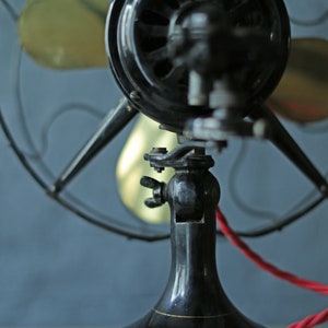 vintage oscillating cast iron base and brass blade fan by Robbins and Myers Co, circa 1920 image 6