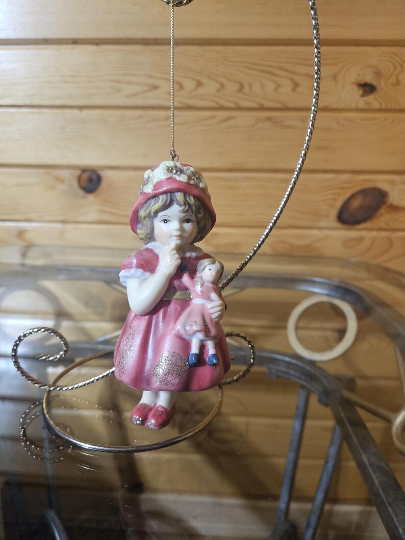 Porcelain Girl Holding Doll Ornament image 1