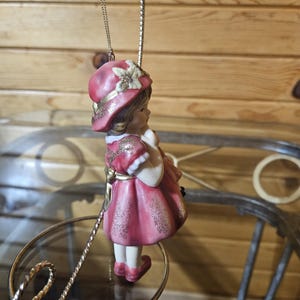 Porcelain Girl Holding Doll Ornament image 4