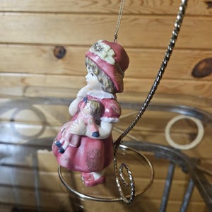 Porcelain Girl Holding Doll Ornament image 2