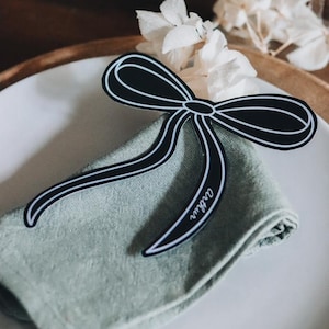 Marque-places Nœud en Papier – Élégance Personnalisée pour Mariages et Événements