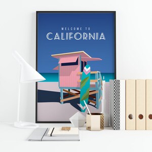 May include: A colorful poster with a pink lifeguard stand and a blue surfboard on a beach. The poster has the text "Welcome to California" in white letters.