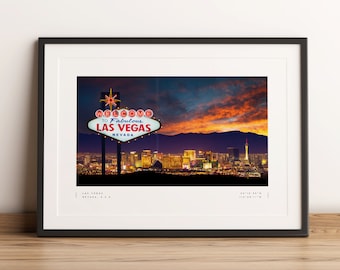 May include: A photograph of the iconic "Welcome to Fabulous Las Vegas" sign at dusk. The sign is illuminated with bright lights against a backdrop of a cityscape and a colorful sunset sky.