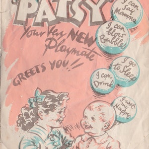 May include: A vintage illustration of a baby doll named Patsy. The doll is dressed in a pink dress and has a blue bow in her hair. The illustration is surrounded by speech bubbles with phrases like "I can cry", "I can say Mamma", and "I can blow bubbles".