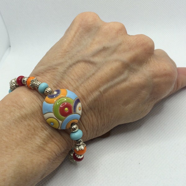 7 inch Colorful Bracelet, "Golem" Glass Focal Bead with multicolored Lampwork Glass beads strung on Leather Silvertone Spacers, OOAK, SRA