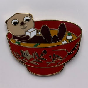 Sea Otter chilling in miso soup hard enamel pin!