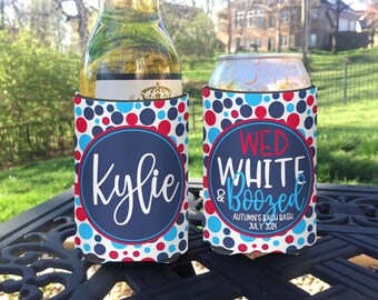 May include: Two red, white, and blue can coolers with polka dots. One cooler says "Kylie" and the other says "Wed White & Boozed Autumn's Bach Bash July 2024".