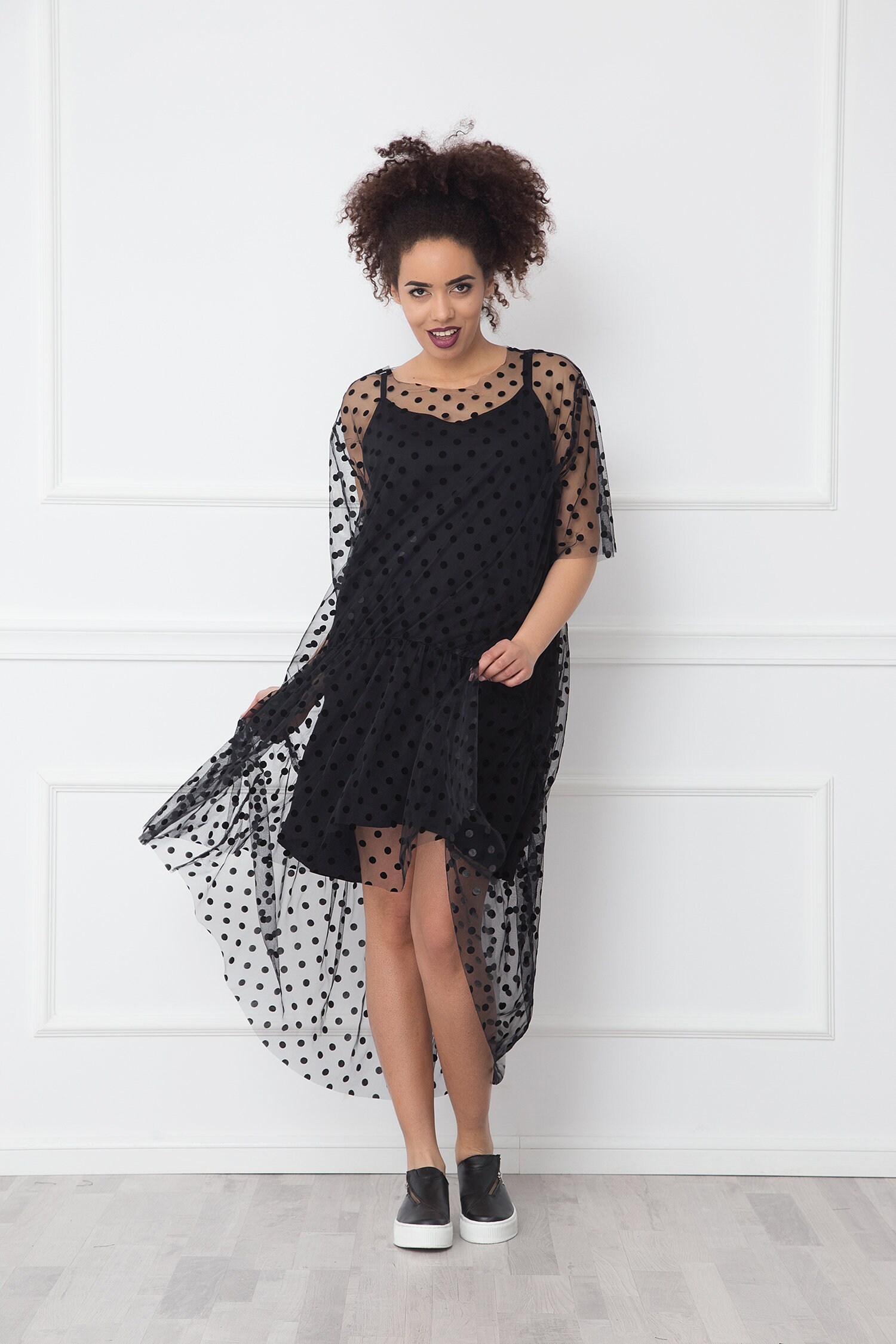 black dress with sheer overlay