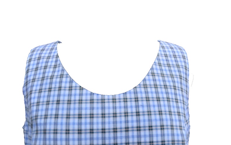 May include: A sleeveless top with a blue and white plaid pattern. The neckline is a scoop neck.