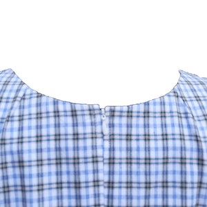 May include: A blue and white plaid dress with a zipper in the back.