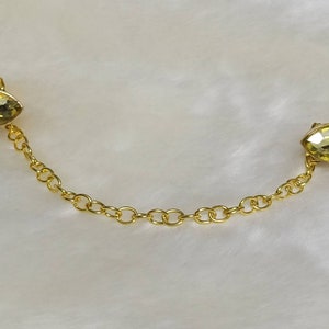 Cloak clasps (color- yellow/green/blues/golds)