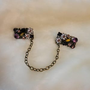 Cloak clasps (bronze/purples/green)