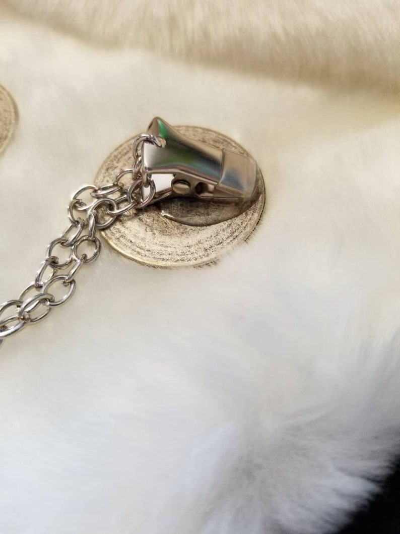 color- silverblack size is approximately half dollar Cloak clasps