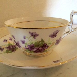 Antique Woodlands Genuine Bone China, Tea Cup And Saucer Set, Made In England. Flowered And Gold Trim.