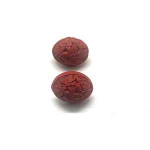 Vintage 1970s Red Acrylic Clip On Earrings: Carved Flower Pattern