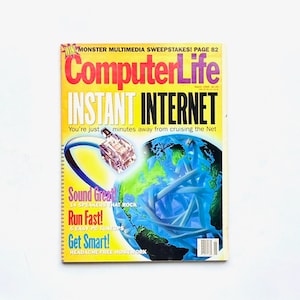 May include: A yellow and purple ComputerLife magazine cover with the text "INSTANT INTERNET" and a graphic of a blue ethernet cable connected to a globe. The text "You're just minutes away from cruising the Net" is below the title.