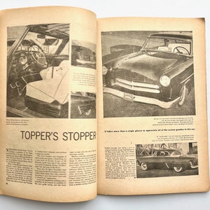 May include: A black and white photo of a 1950s era custom car. The car has a chrome bumper, a black grille, and a white roof. The car is parked on a street. The text "Topper's Stopper" is printed in large letters at the bottom of the page.