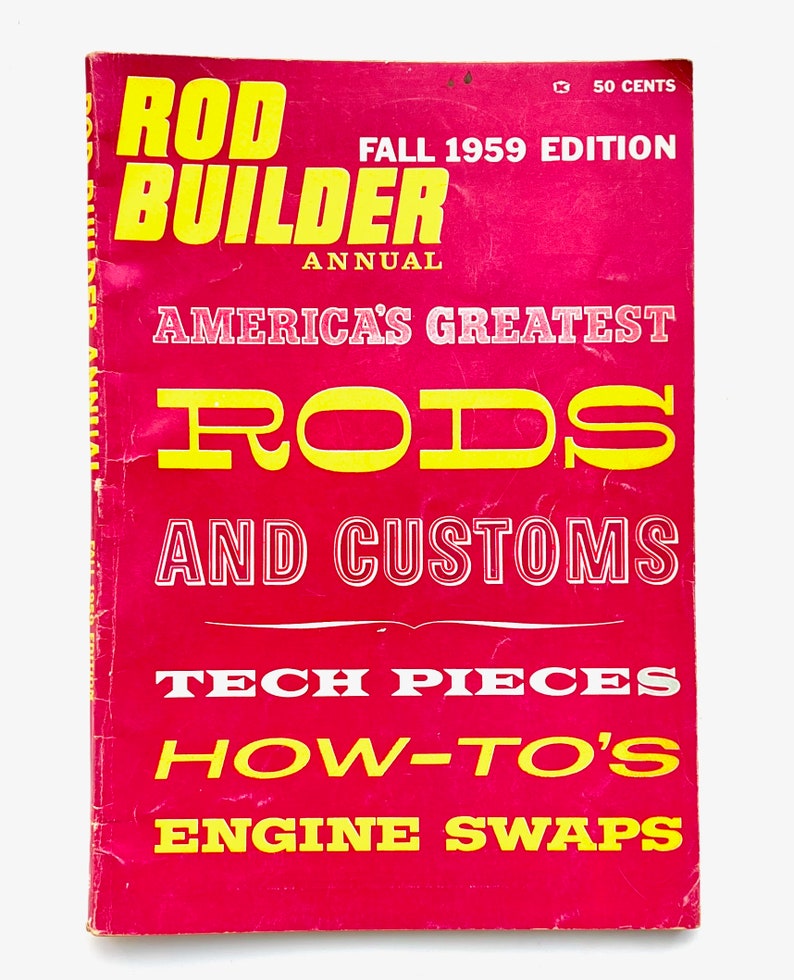 May include: A red magazine cover with the title "Rod Builder Annual" in yellow letters. The cover also features the text "America's Greatest Rods and Customs" in yellow letters, and "Tech Pieces, How-To's, Engine Swaps" in white letters.