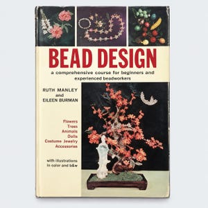 May include: A hardcover book titled Bead Design by Ruth Manley and Eileen Burman. The cover features a large red title, a subtitle, and photographs of beaded flowers, jewelry, and a beaded tree. The book includes illustrations in color and b&w.