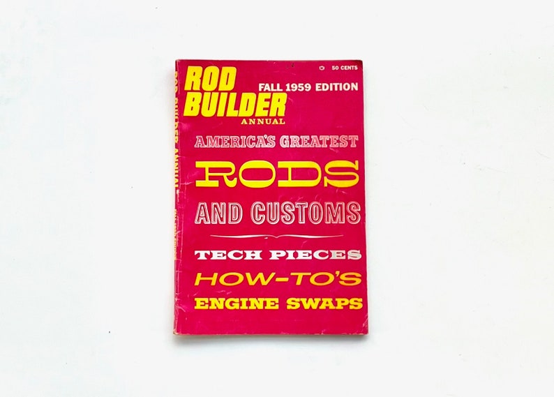 May include: A red magazine cover with the title "Rod Builder Annual" and the text "America's Greatest Rods and Customs" in yellow. The cover also features the text "Tech Pieces, How-To's, Engine Swaps" in yellow.