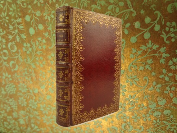 1746 Almanach Royal (Royal Almanac). Red morocco binding. Brocade endpapers.
