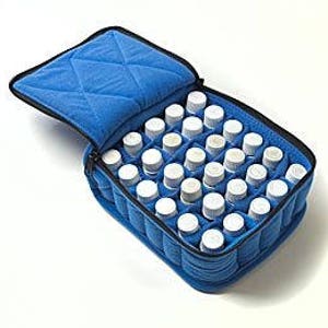 May include: Blue padded carrying case with 30 slots for essential oil bottles.